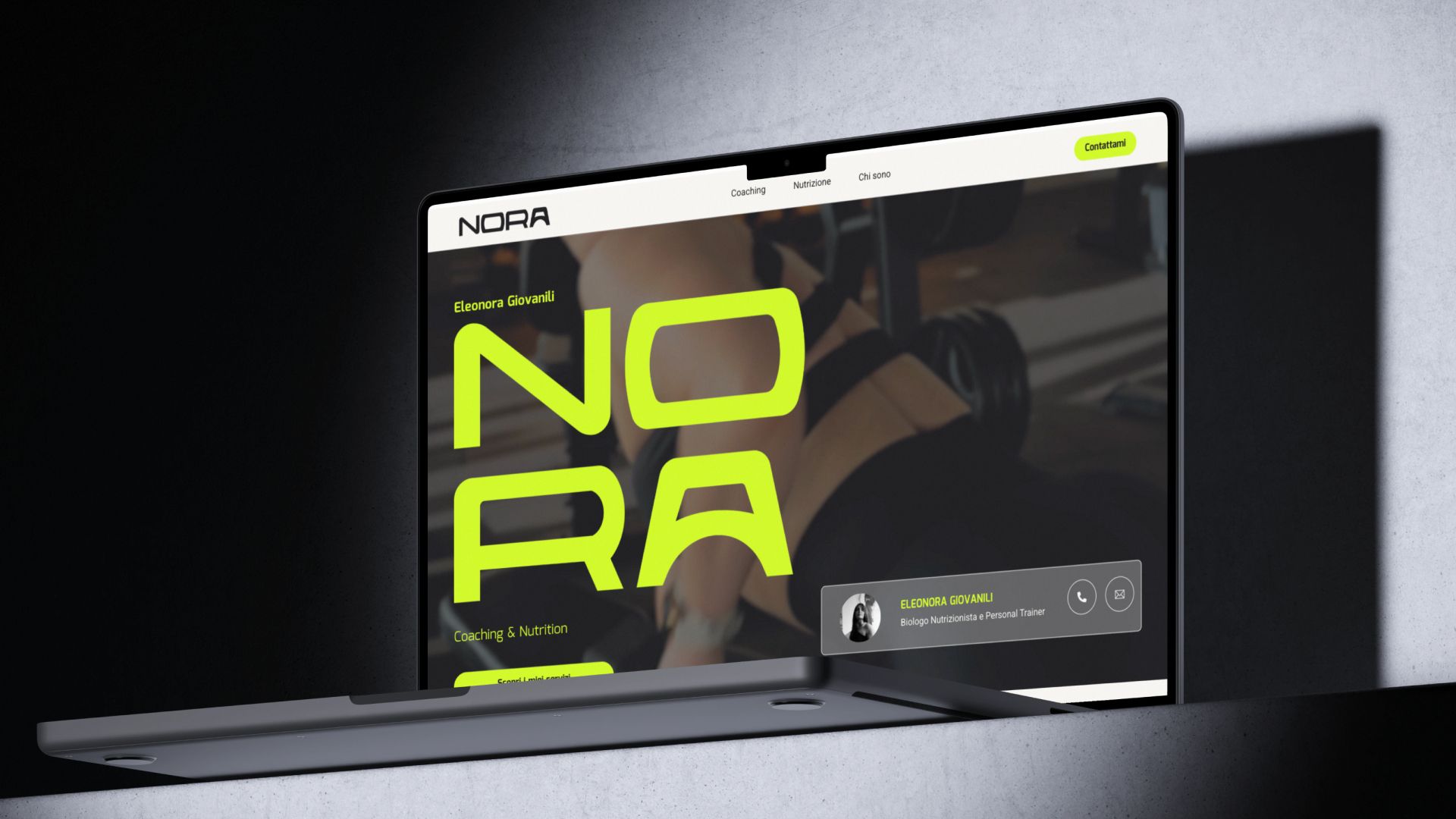 The Noranutrizione home page on a laptop, with the logotype in acid yellow