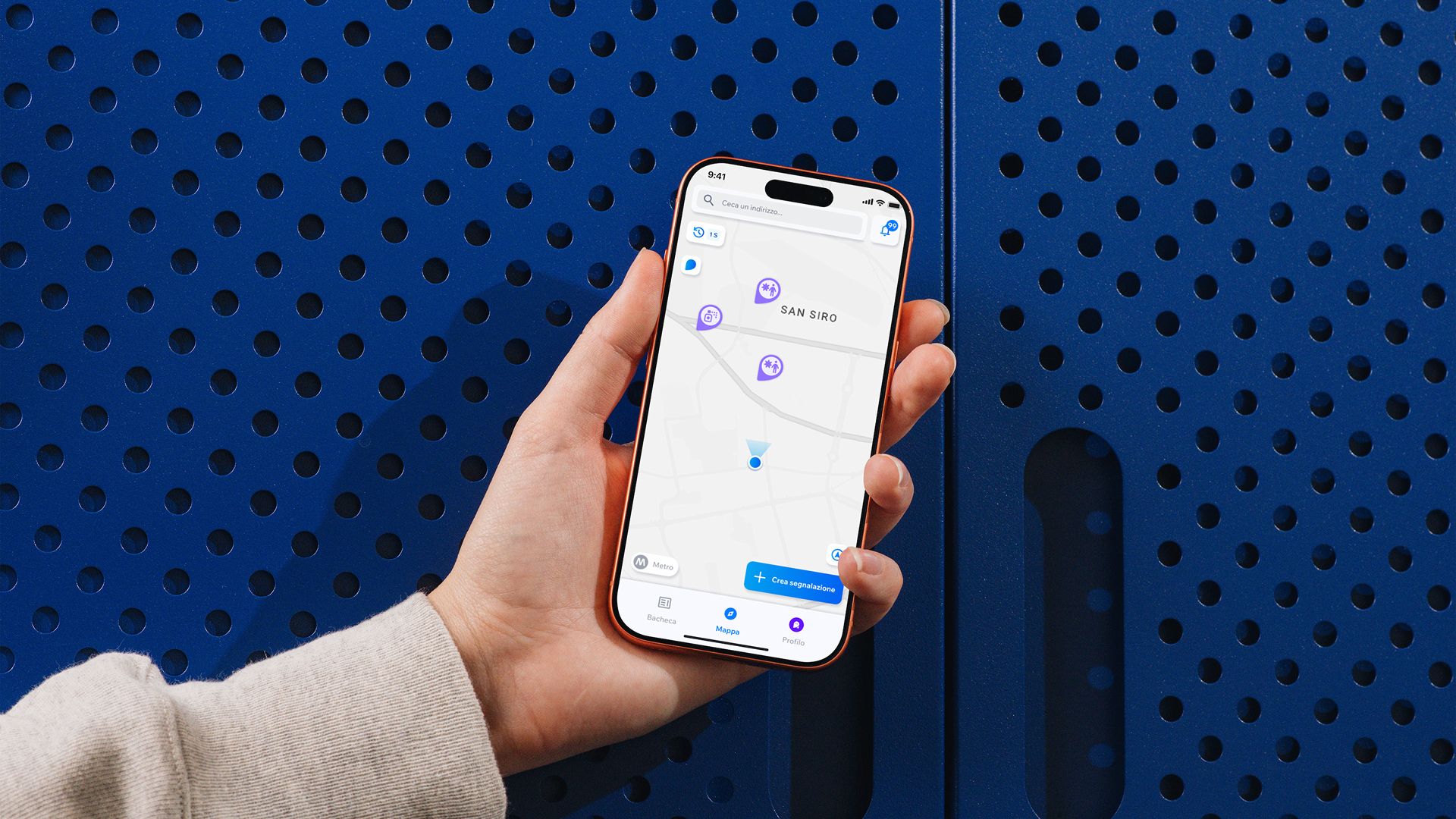 A hand holds a smartphone showing the Seezy map, on a perforated blue background